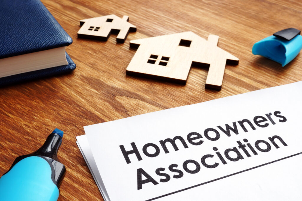 document that says Homeowners Association on desk